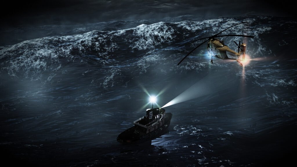 Akcja ratunkowa na morzu. Helikopter i łódź nocą